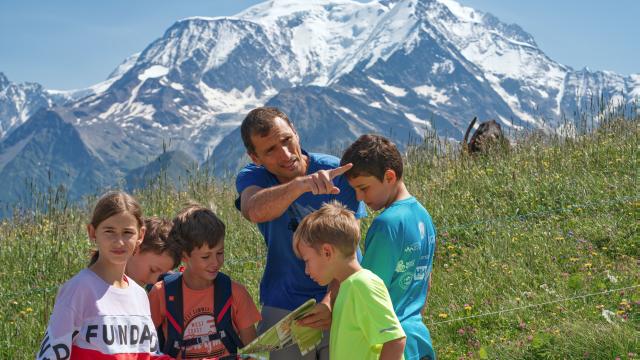 Reading a hiking map in the mountains of Saint-Gervais Mont-Blanc